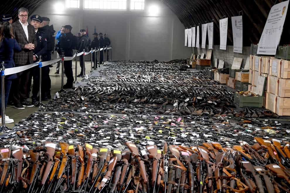 Serbian president Aleksandar Vucic, left, inspected weapons collected as part of the amnesty (Serbian Presidential Press Service via AP)