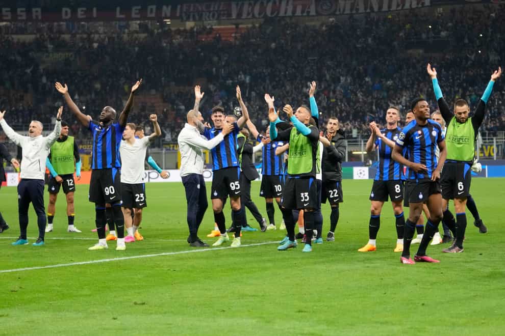 Inter Milan players celebrate at the end of the Champions League semi-final second leg (Luca Bruno/AP)
