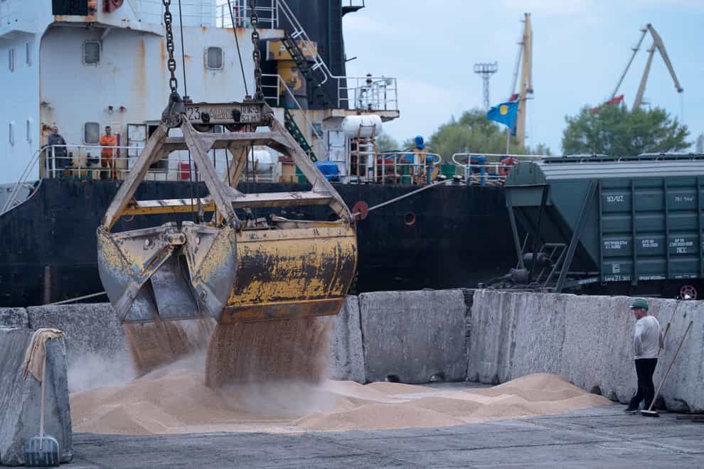 Workers load grain at a grain port in Izmail, Ukraine (Andrew Kravchenko/AP/PA)