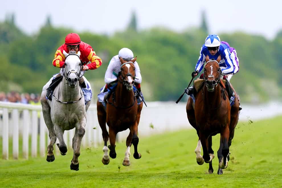 The Foxes ridden by jockey Oisin Murphy (right, blue and white silks) on their way to winning the Al Basti Equiworld Dubai Dante Stakes on day two of the Dante Festival 2023 at York Racecourse. Picture date: Thursday May 18, 2023. (Mike Egerton/PA)