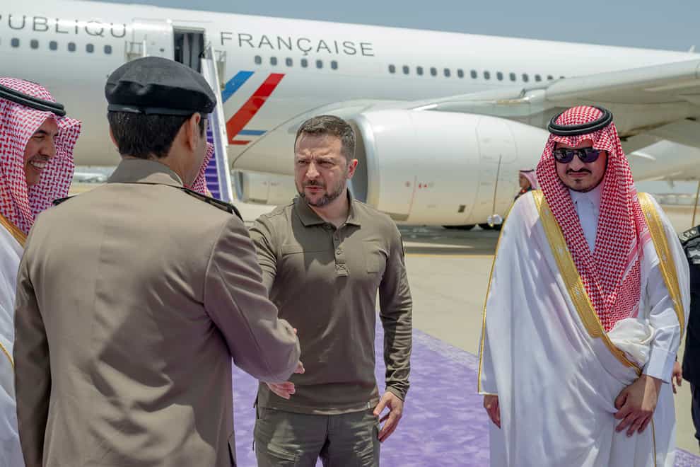 President Volodymyr Zelensky is greeted by Prince Badr Bin Sultan, deputy governor of Mecca (Saudi Press Agency via AP)