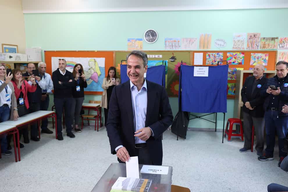 Greece’s Prime Minister and leader of New Democracy Kyriakos Mitsotakis votes at a polling station in Athens, Greece (Yorgos Karahalis/AP)