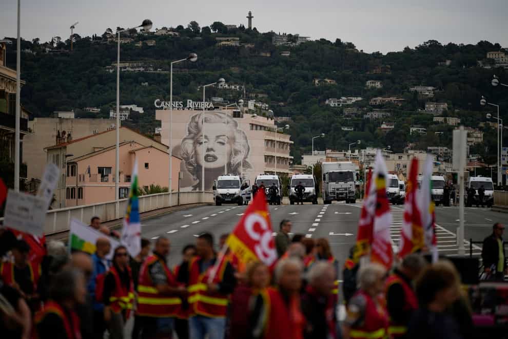 Demonstrators protest against Emmanuel Macron’s pension reform in Cannes (Daniel Cole/AP)