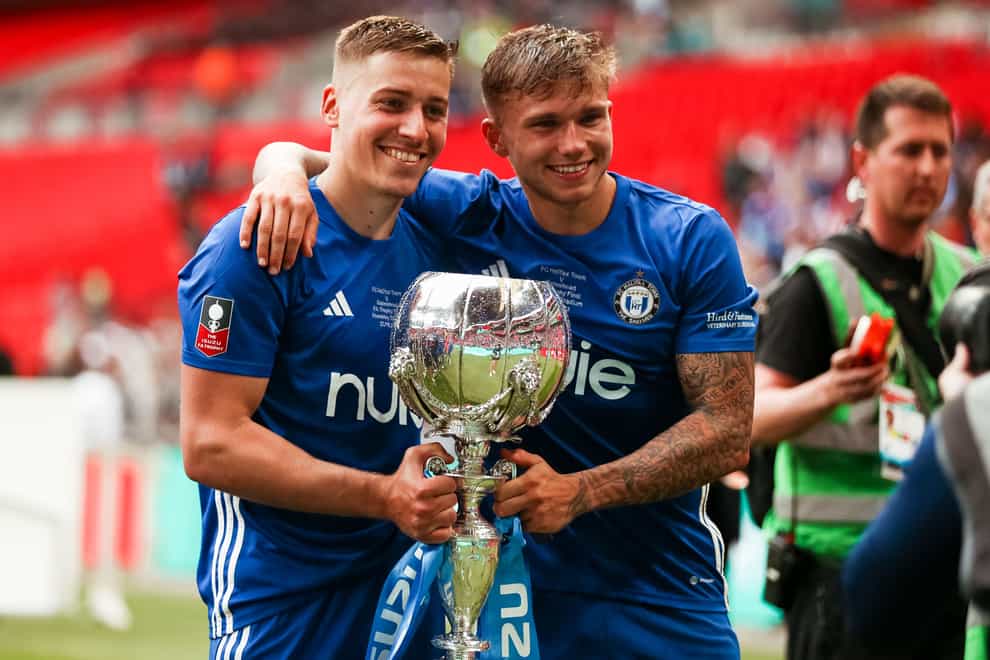 Halifax Town’s Tylor Golden and goalscorer Jamie Cooke pose with the trophy (Rhianna Chadwick/PA)