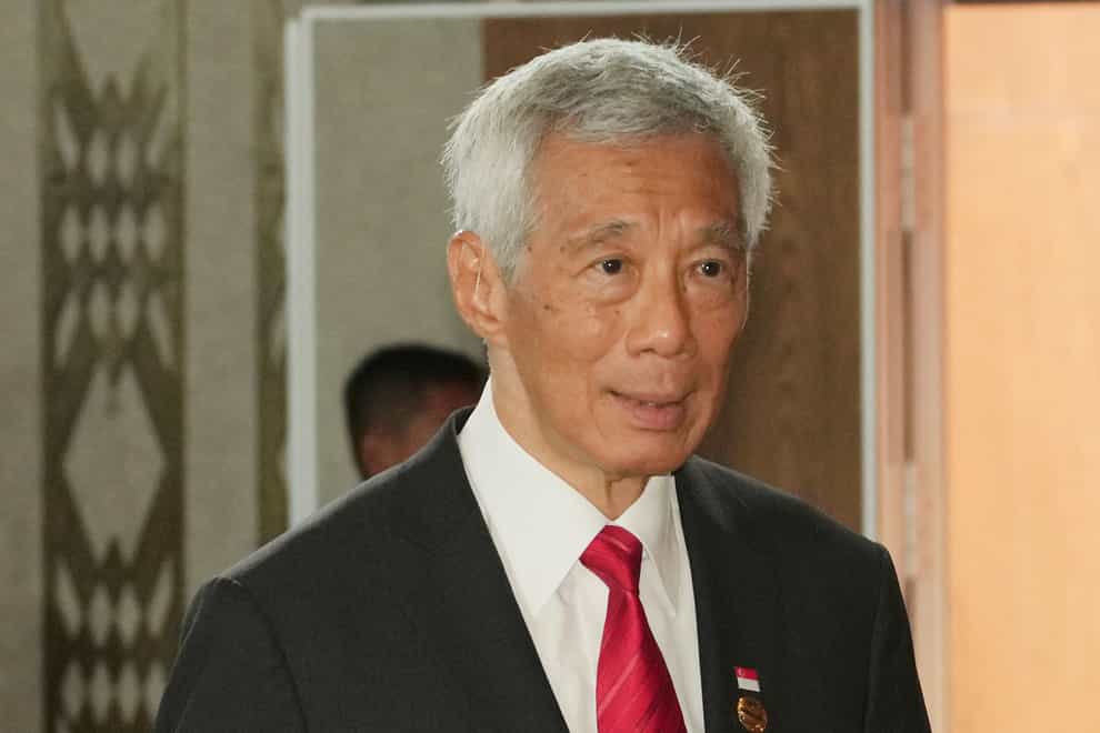 Singapore’s PM Lee Hsien Loong has tested positive for Covid-19 (Achmad Ibrahim/AP)