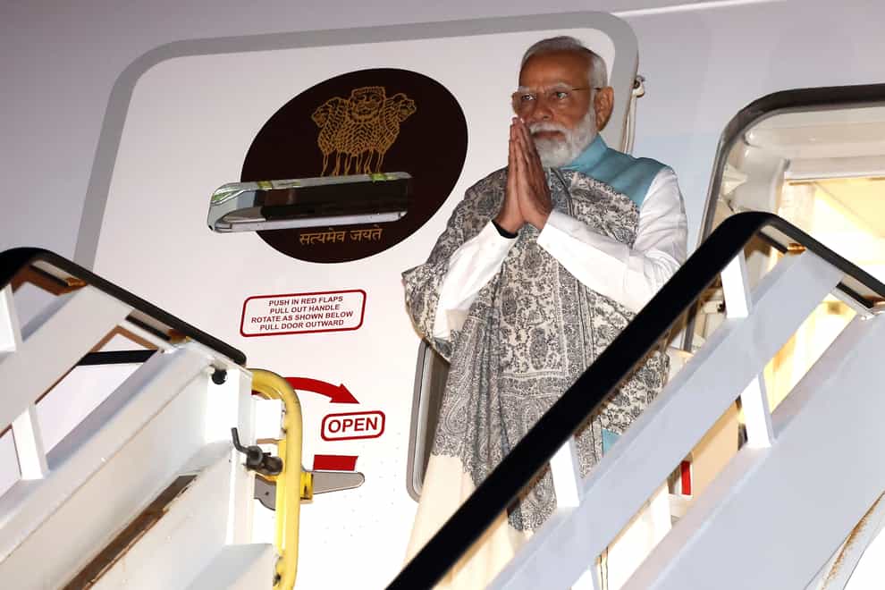 India’s Prime Minister Narendra Modi gestures as he arrives at the Sydney international airport (Dave Gray/Pool/AP)