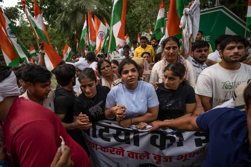 India’s top female wrestlers and their supporters march towards landmark India Gate monument protesting against Wrestling Federation of India President Brijbhushan Sharan Singh in New Delhi, India on Tuesday, May 23, 2023 (Altaf Qadri/AP/PA)