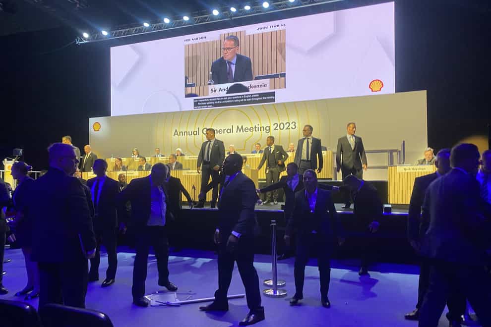 Security guards stopped protesters reaching the stage at Shell’s AGM (Rebecca Speare-Cole/PA)