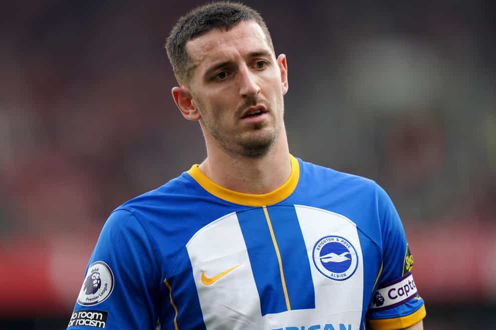 Brighton captain Lewis Dunk is a doubt for the visit of Manchester City (Tim Goode/PA)