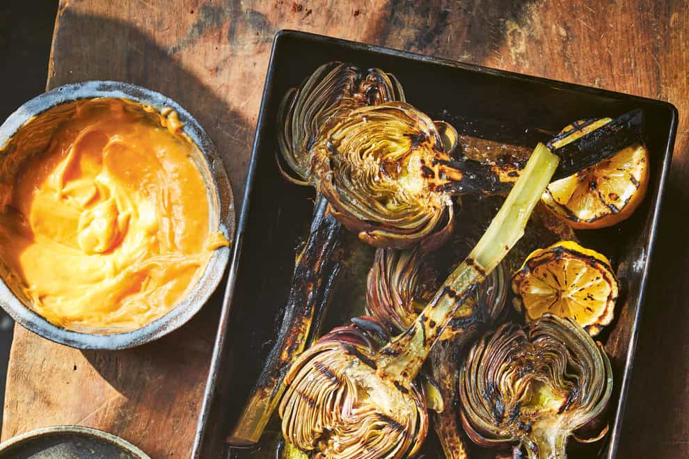 Grilled artichokes with hollandaise from Big Green Egg Feasts (Sam Folan/PA)