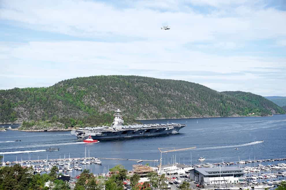 The aircraft carrier travels through the Oslo fjord (Terje Pedersen/NTB Scanpix via AP)