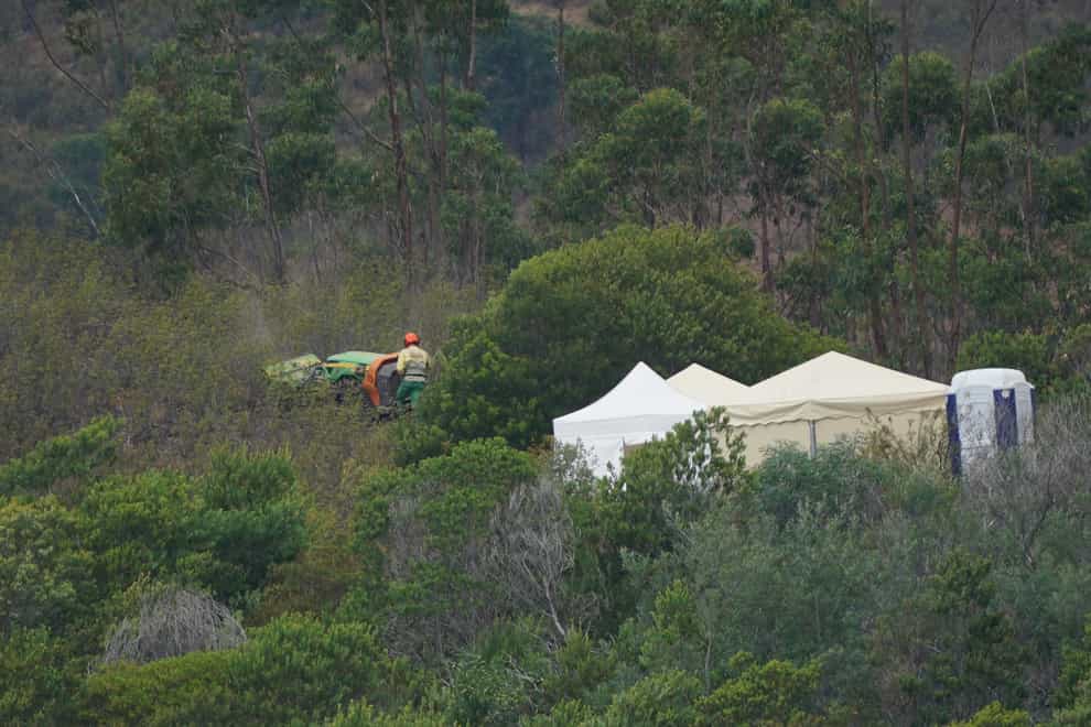 Personnel clear undergrowth with machinery at Barragem do Arade reservoir, in the Algave, Portugal, as searches continue as part of the investigation into the disappearance of Madeleine McCann (Yui Mok/PA)
