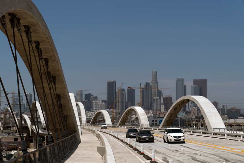 A 17-year-old boy fell to his death while climbing a Los Angeles bridge for an apparent social media stunt, police said (Jae C Hong/AP)