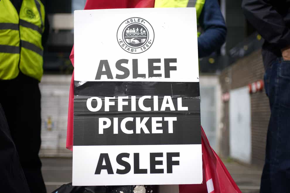 Members of the drivers’ union Aslef on the picket line at Euston station (Yui Mok/PA)