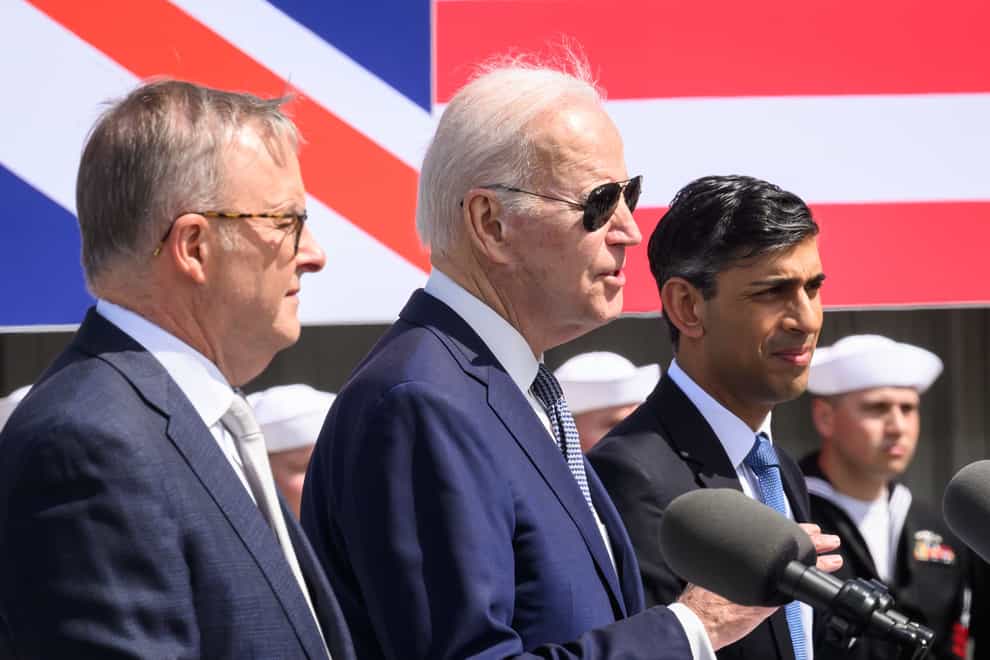 Left to right, Australian Prime Minister Anthony Albanese, US President Joe Biden and Prime Minister Rishi Sunak in March (Leon Neal/PA)