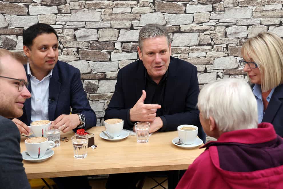 Labour leader Sir Keir Starmer, centre, with Scottish leader Anas Sarwar as they met constituents in Rutherglen, South Lanarkshire (Robert Perry/PA)