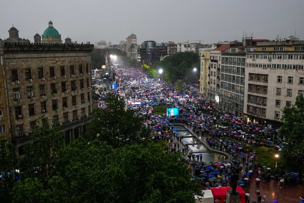Thousands attend a rally in support of President Aleksandar Vucic in front of the Serbian parliament building in Belgrade, Serbia (Darko Vojinovic/AP/PA)
