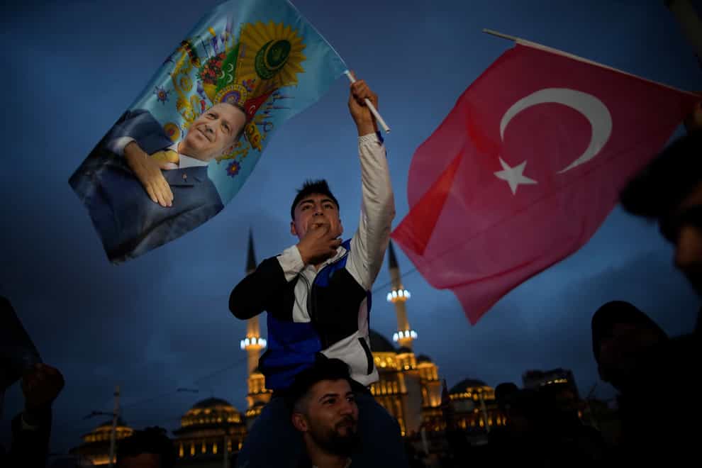 Supporters of President Recep Tayyip Erdogan celebrate in Istanbul (Emrah Gurel/AP)
