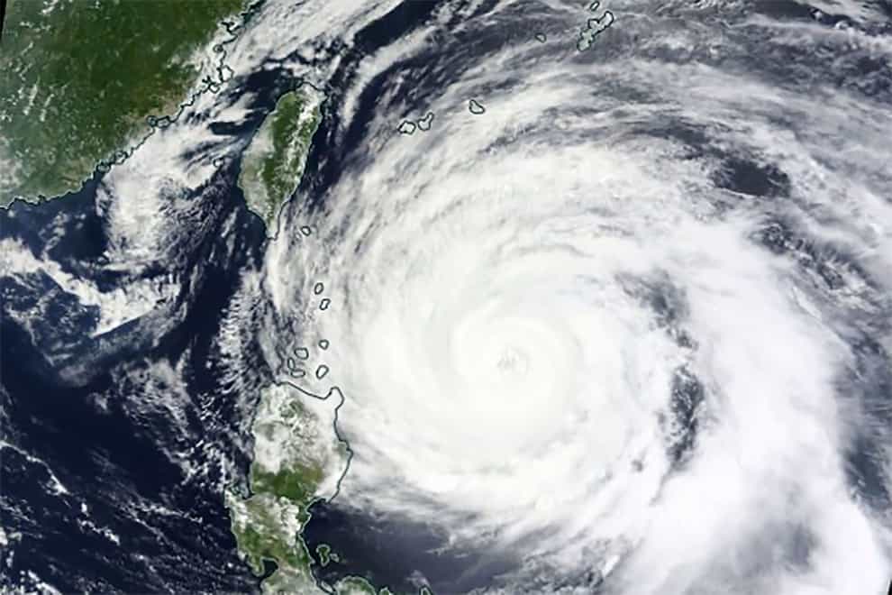 Satellite image of Typhoon Mawar approaching Philippines’ northern provinces (Nasa Worldview, Earth Observing System Data and Information System via AP)