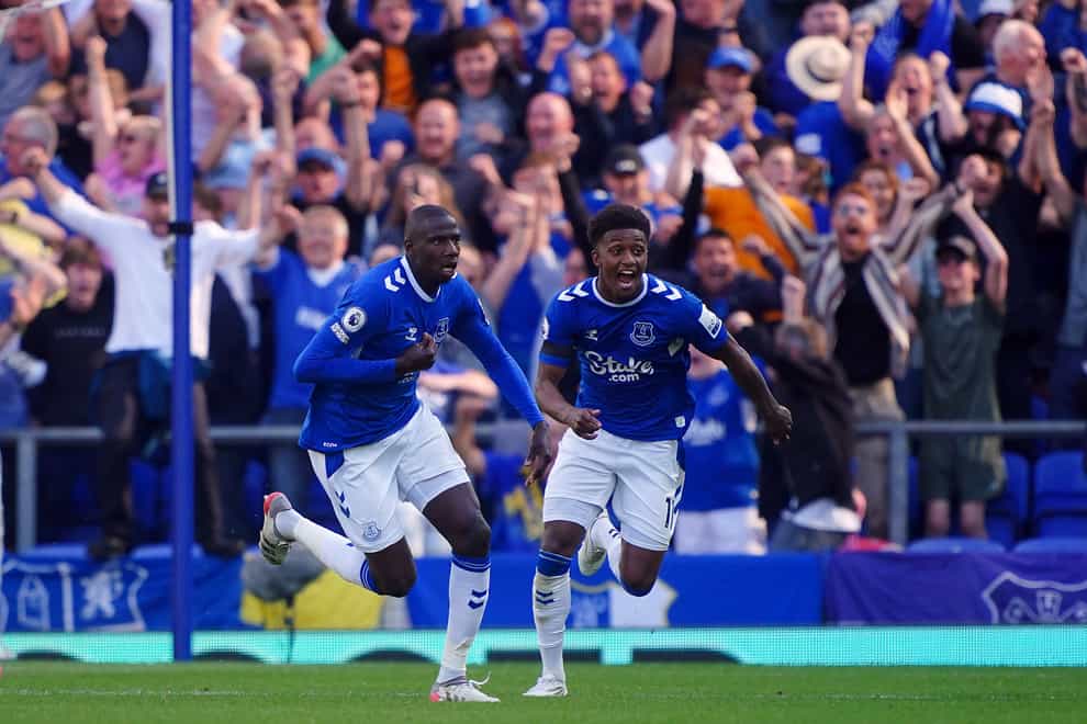 Abdoulaye Doucoure, left, celebrates after scoring the only goal in Everton’s win over Bournemouth that secured their Premier League safety (Peter Byrne/PA)