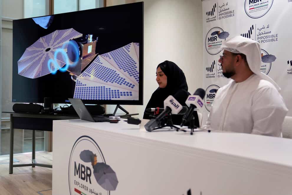 Mohsen Al Awadhi, director of UAE Space Missions Department, right, and Hoor AlMaazmi UAE, space science researcher, take part at a press conference revealing the latest news about the Emirates Mission to the Asteroid Belt, in Dubai, United Arab Emirates (Kamran Jebreili/AP/PA)