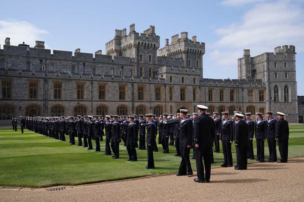 Members of the Royal Navy before being presented with their Royal Victorian Order medals by the King for their part in Queen Elizabeth II’s funeral procession, on the Quadrangle at Windsor Castle (Jonathan Brady/PA)