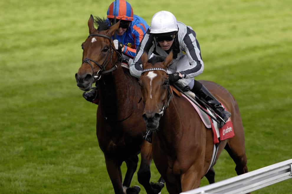 Light Shift, ridden by Ted Durcan (right) wins the Vodafone Oaks ahead of Peeping Fawn, ridden by Martin Dwyer at Epsom Downs Racecourse, Surrey.