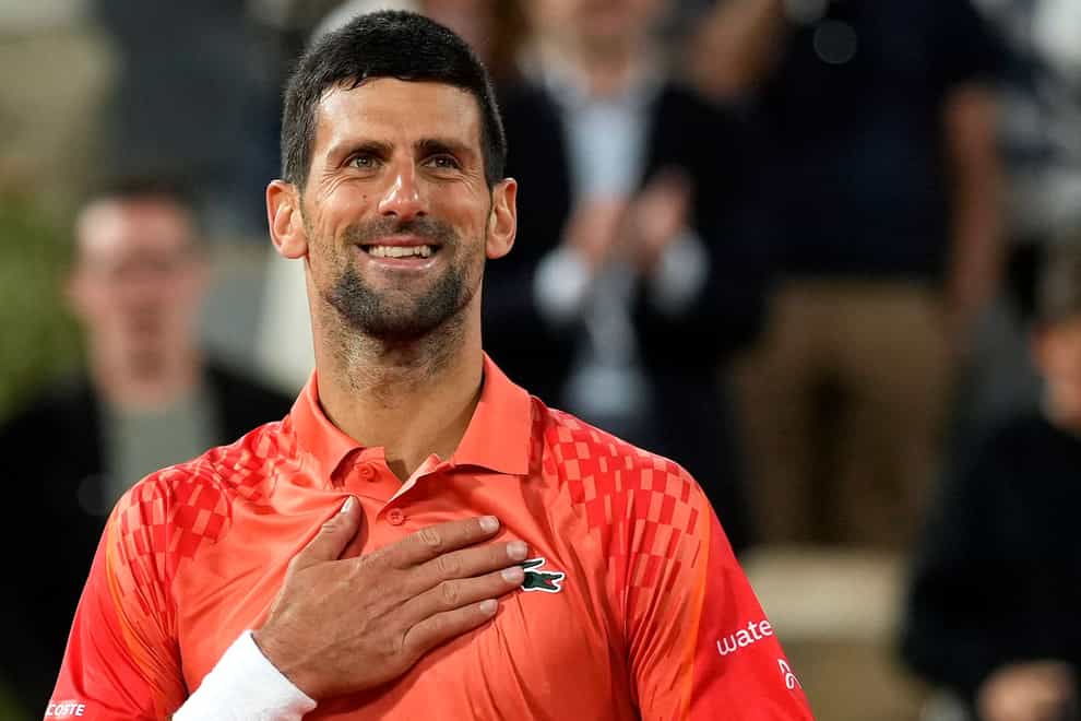 Novak Djokovic smiles after beating Marton Fucsovics (Thibault Camus/AP)