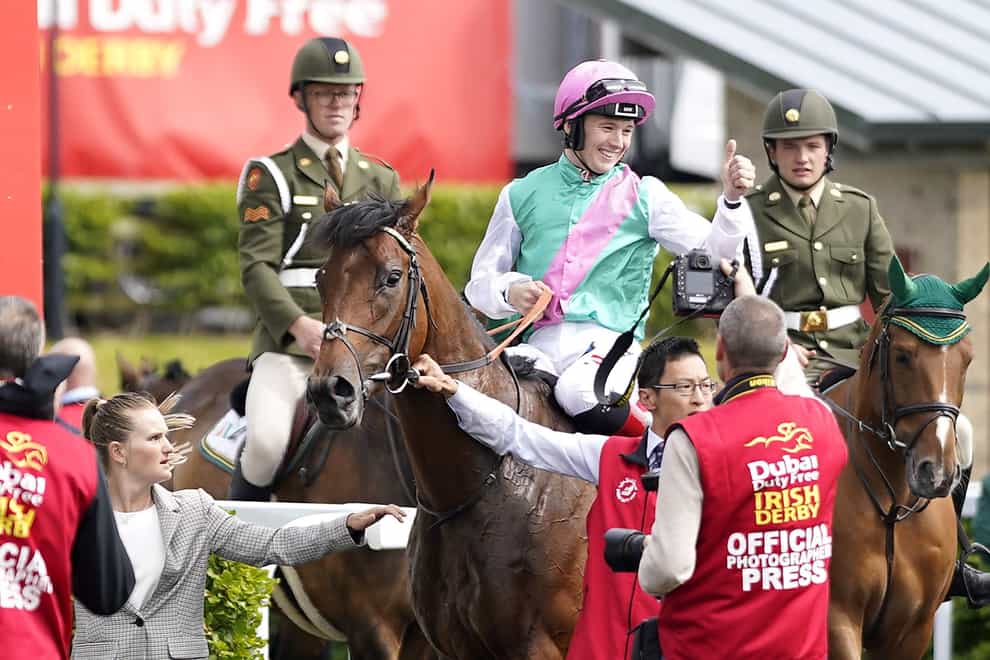 Colin Keane celebrates after winning the Dubai Duty Free Irish Derby with horse Westover (Niall Carson/PA)