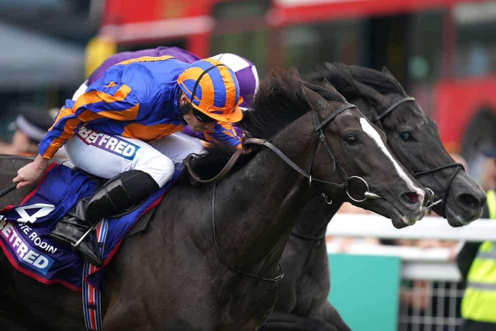 Auguste Rodin ridden by jockey Ryan Moore (front) wins the Betfred Derby ahead of King of Steel ridden by jockey Kevin Stott during Derby Day of the 2023 Derby Festival at Epsom Downs Racecourse, Epsom. Picture date: Saturday June 3, 2023.