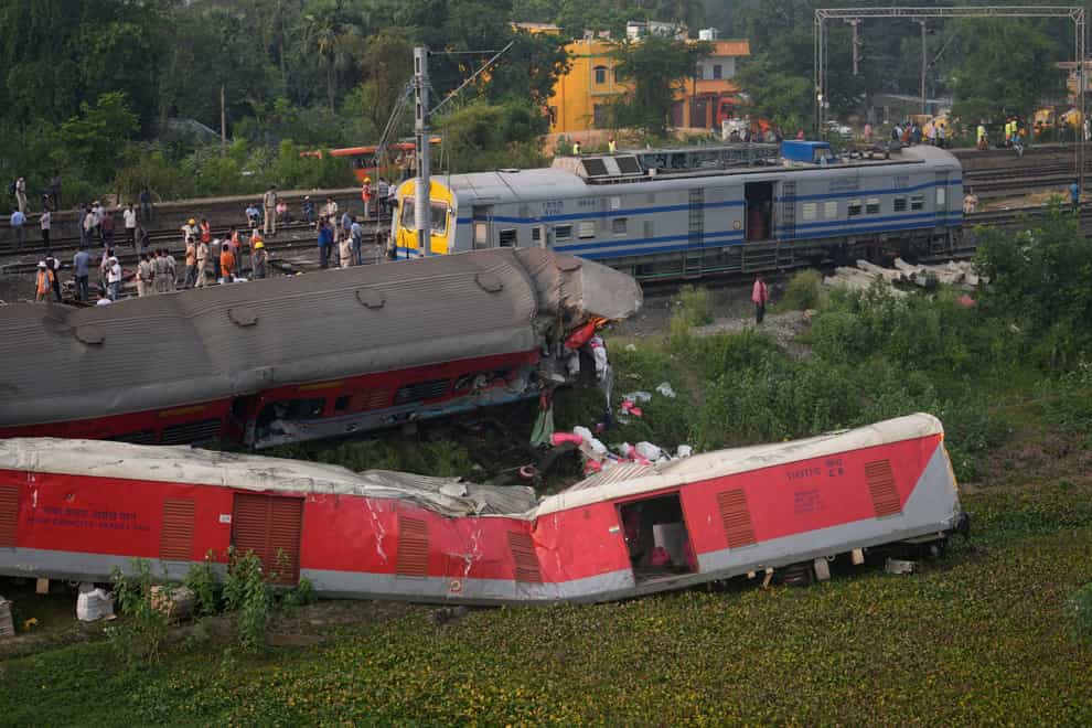 The rail crash in eastern India which killed more than 300 people and injured hundreds of others was caused by an error in the electronic signalling system which led to a train wrongly changing tracks, India’s railways minister said (Rafiq Maqbool/AP)