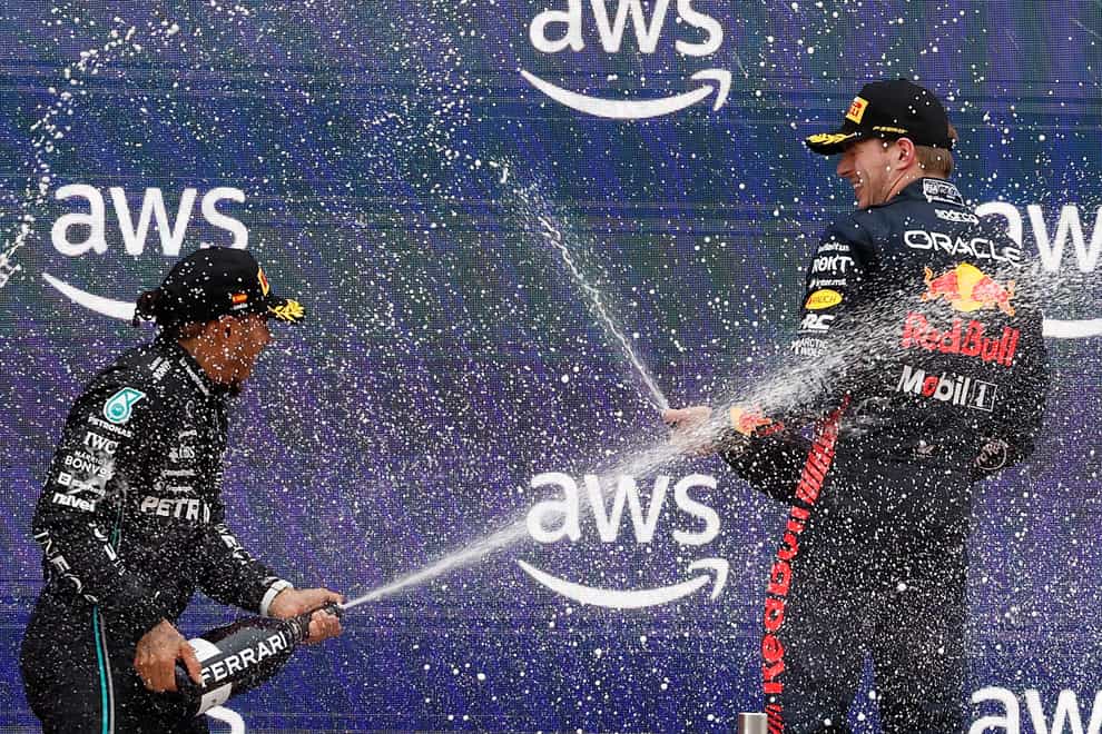 Lewis Hamilton, left, and Max Verstappen celebrate on the podium in Barcelona (Joan Monfort/AP)