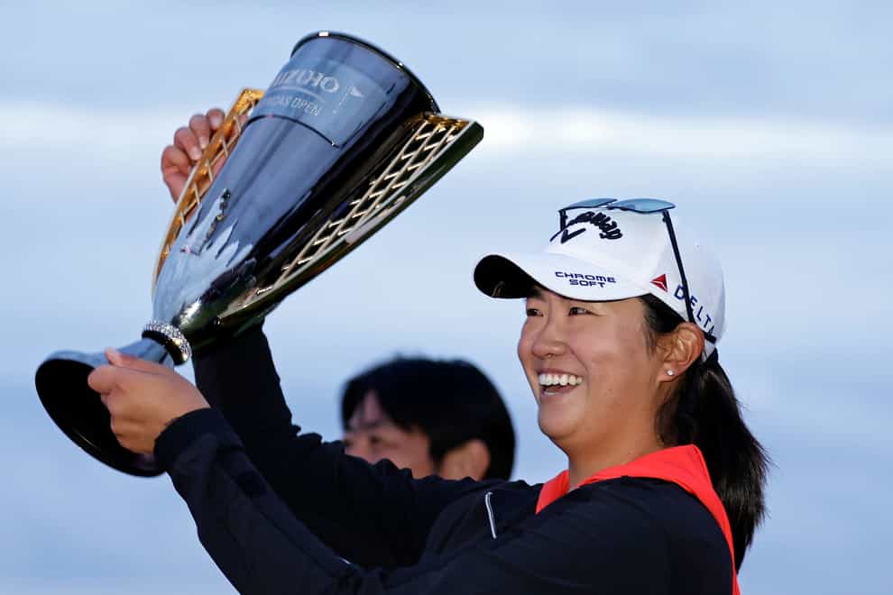 Rose Zhang holds up the trophy after winning the Mizuho Americas Open (Adam Hunger/AP)