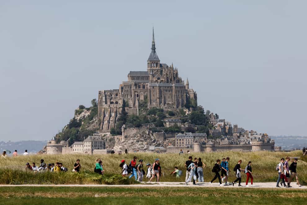 Mont-Saint-Michel is a famed landmark and major tourist attraction in Normandy (Ludovic Marin, Pool via AP)