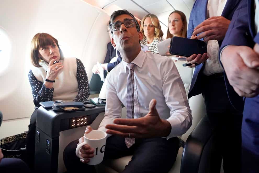 Prime Minister Rishi Sunak holds a huddle with political journalists on board a government plane as he heads to Washington DC in the US. Picture date: Tuesday June 6, 2023.