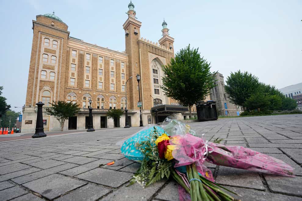 Flowers are placed in front of the Altria Theatre which was the site of a mass shooting after a graduation ceremony in Richmond, Virginia (Steve Helber/AP/PA)
