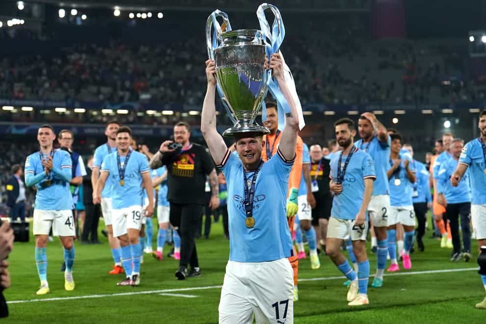 Manchester City’s Kevin De Bruyne lifts the Champions League trophy (Martin Rickett/PA).