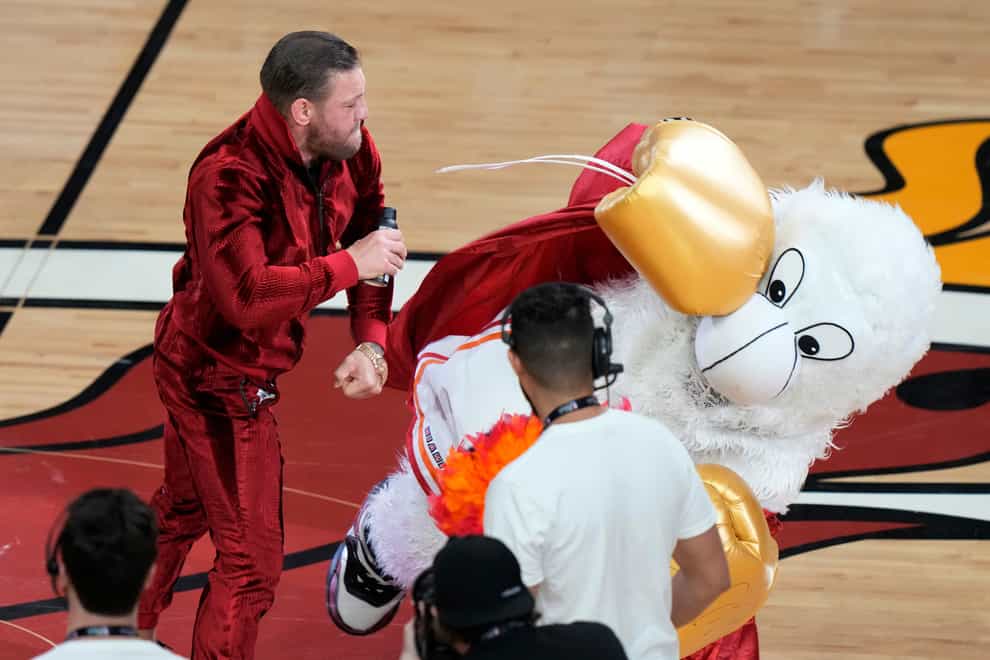 Former UFC champion Conor McGregor (left) punched Burnie the Miami Heat mascot (Lynne Sladky/AP)