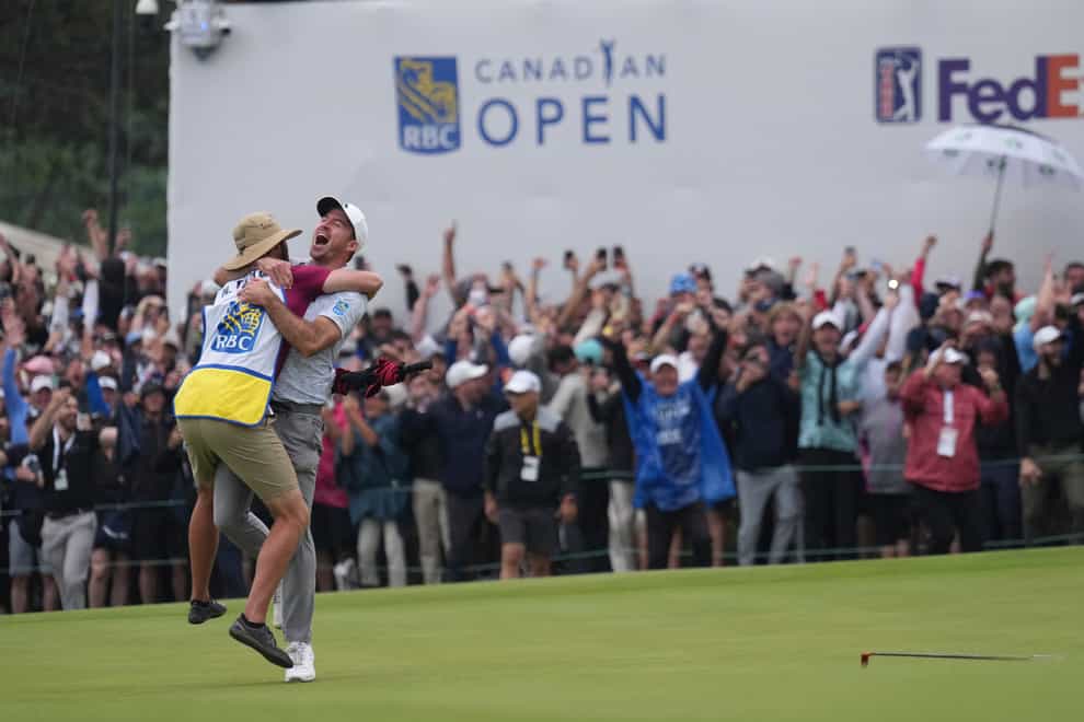 Nick Taylor, second from left, of Canada, reacts after winning the Canadian Open golf tournament on the fourth playoff hole against Tommy Fleetwood, of the United Kingdom, in Toronto, Sunday, June 11, 2023. (Nathan Denette/The Canadian Press via AP)