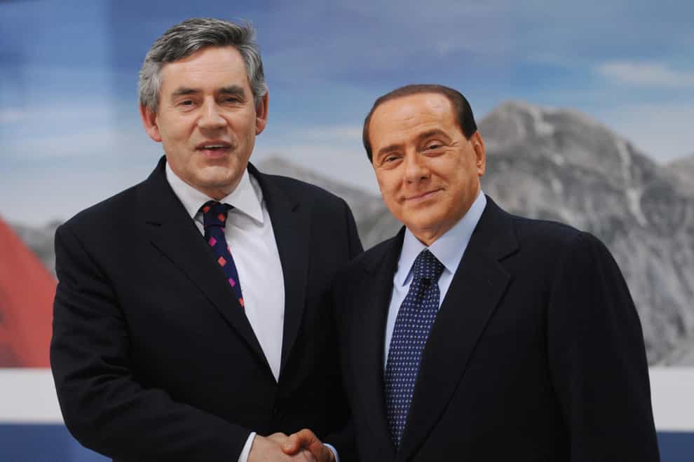 Former prime minister Gordon Brown with Silvio Berlusconi (Stefan Rousseau/PA)