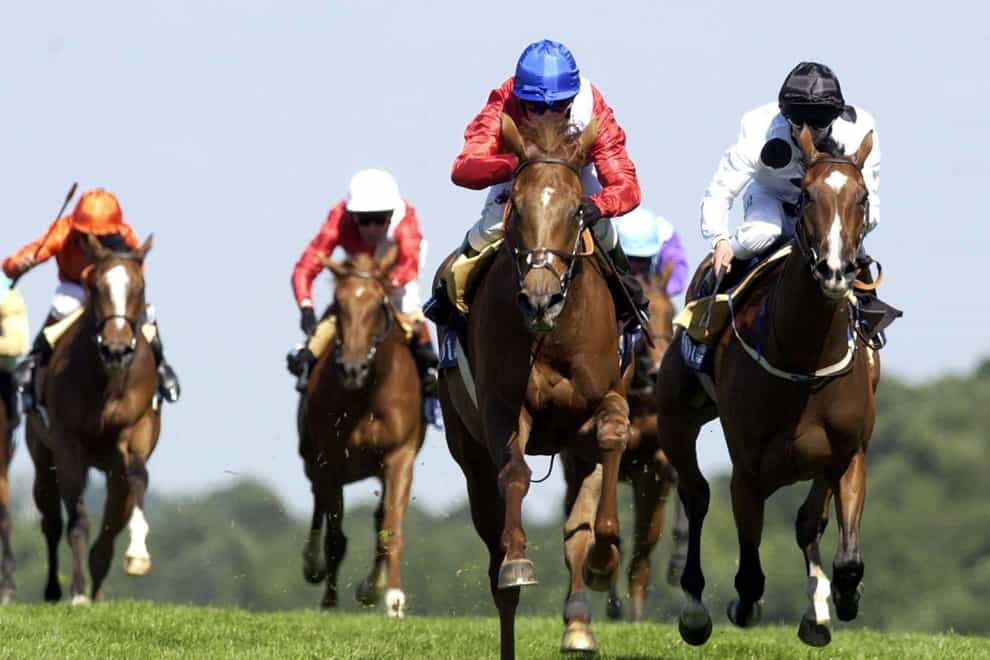Kieran Falllon riding Russian Rythm (Blue Hat) beats off the challenge of Soviet Song (Black hat) to win The Coronation Stakes, at Royal Ascot (Chris Young/PA)