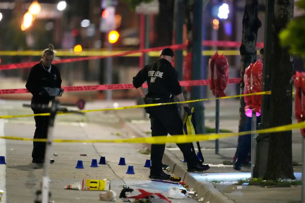 Denver Police Department investigators at the scene of a mass shooting (David Zalubowski/AP/PA)