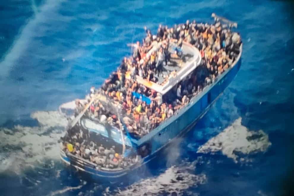 A fishing boat crammed to the gunwales with migrants trying to reach Europe capsized and sank on Wednesday off the coast of Greece, authorities said (Hellenic Coast Guard/AP)