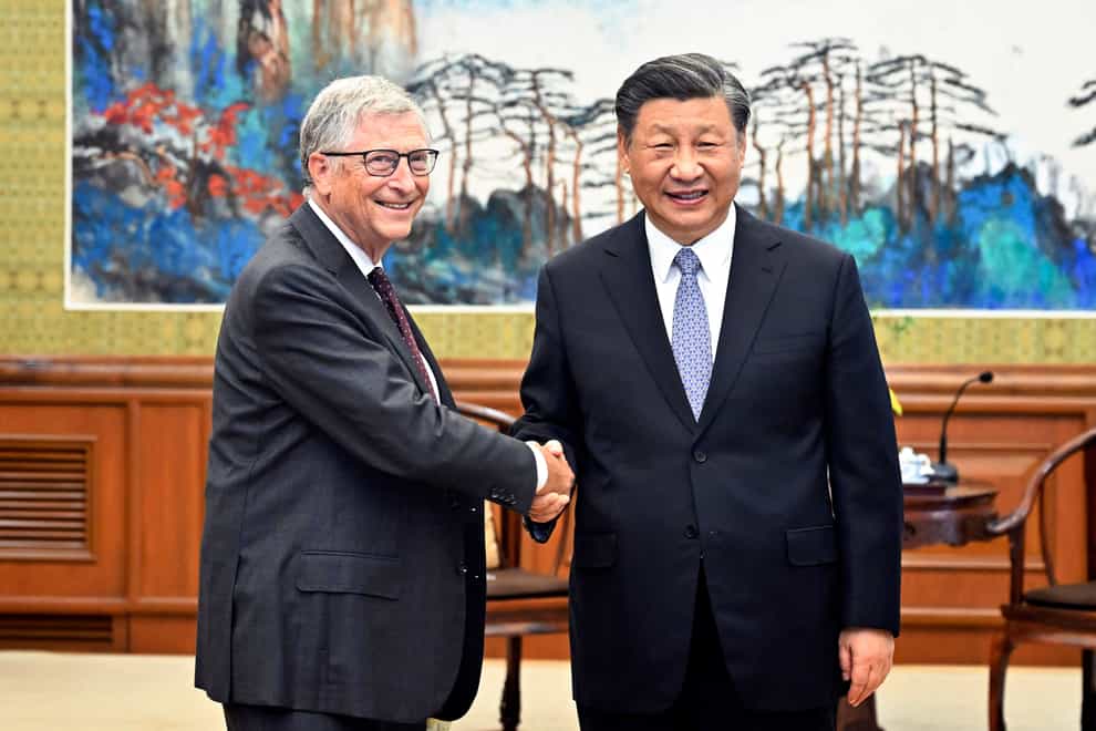 Bill Gates, left, meets with Chinese president Xi Jinping in Beijing (Yin Bogu/Xinhua via AP)