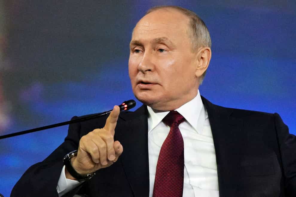 Russian president Vladimir Putin gestures while speaking at a plenary session of the St Petersburg International Economic Forum (Alexei Danichev/Photo host Agency RIA Novosti via AP)