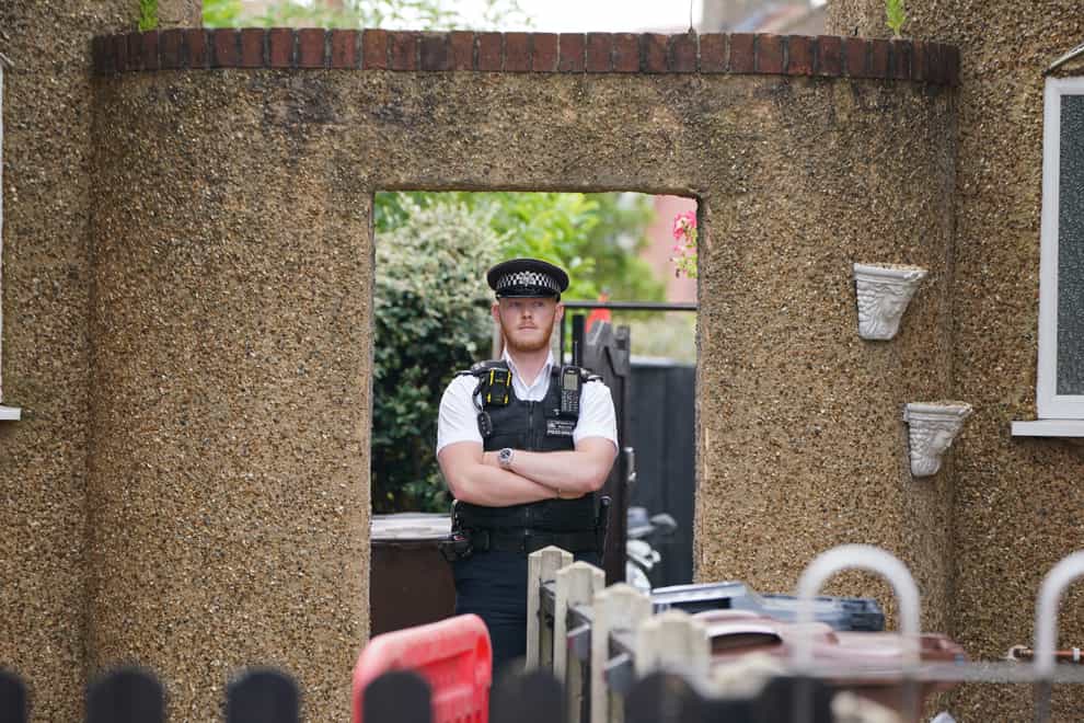 Police at the scene in Bedfont, Hounslow where a three-year-old boy and a girl, 11, are among four people who have been found dead in a flat in west London. Picture date: Saturday June 17, 2023.