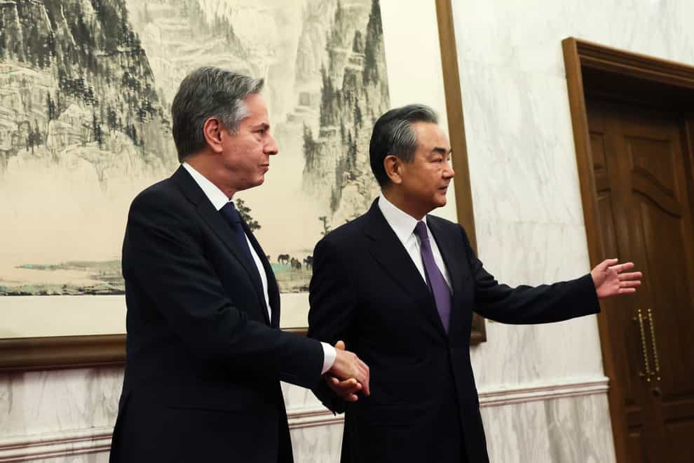 US secretary of state Antony Blinken shakes hands with China’s top diplomat Wang Yi (Pool via AP)