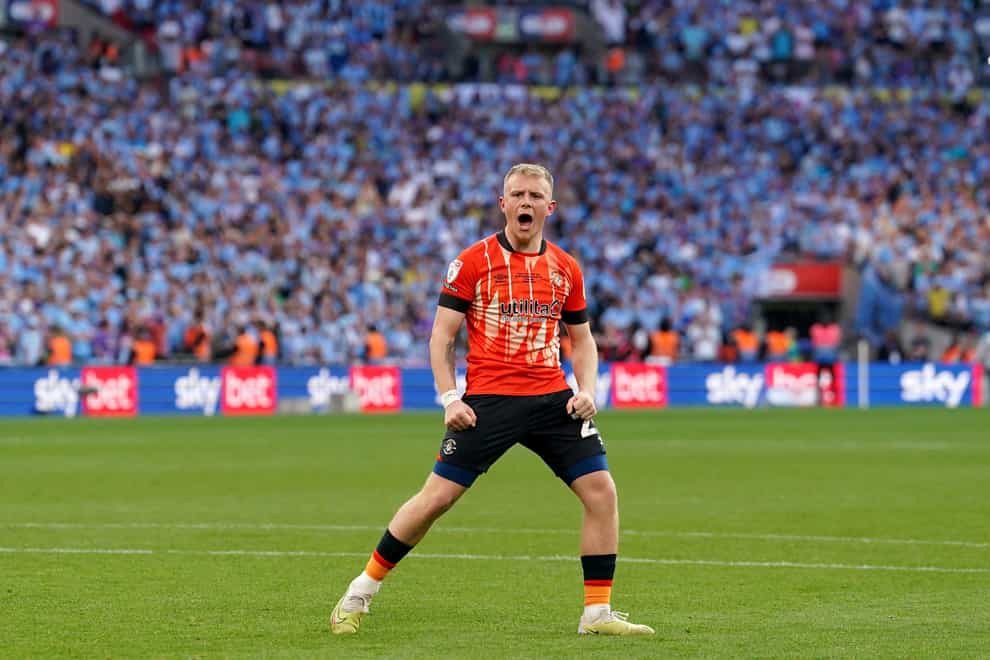 Joe Taylor celebrates after scoring in the Wembley penalty shoot-out that took Luton into the Premier League (Adam Davy/PA)