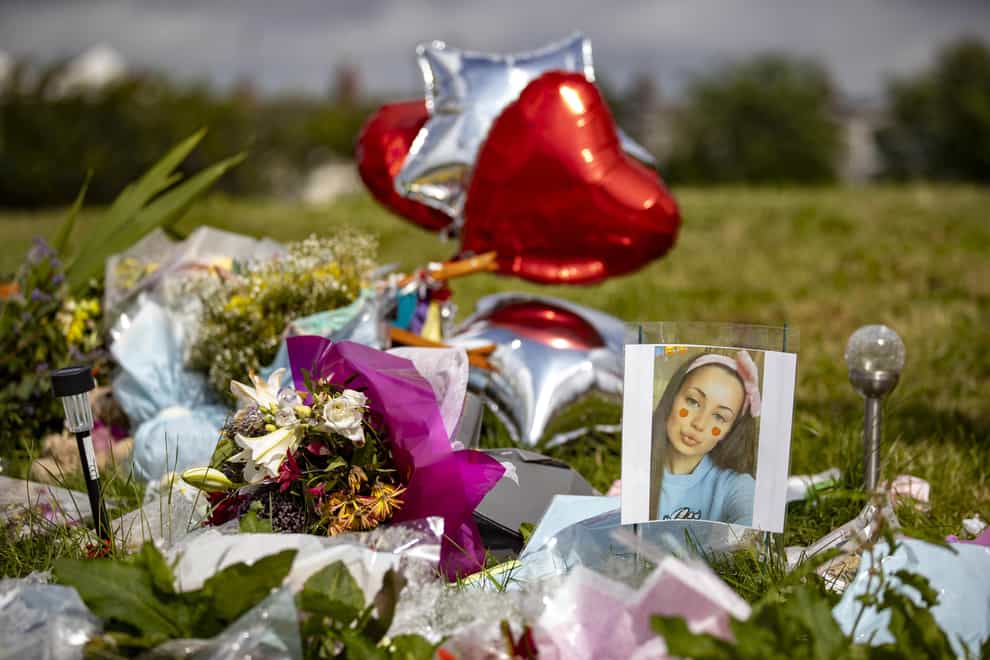 Floral tributes at King George’s Park in Harryville, Ballymena, in remembrance of Chloe Mitchell (Liam McBurney/PA)