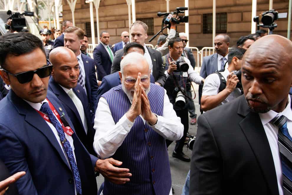 Indian Prime Minister Narendra Modi greets supporters as he arrives in New York (AP)